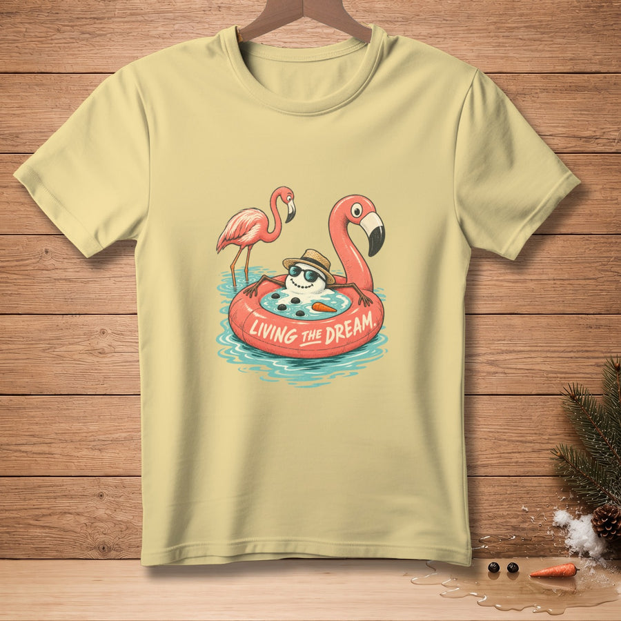 Snowman in a flamingo float with text "LIVING THE DREAM" and two flamingos.
