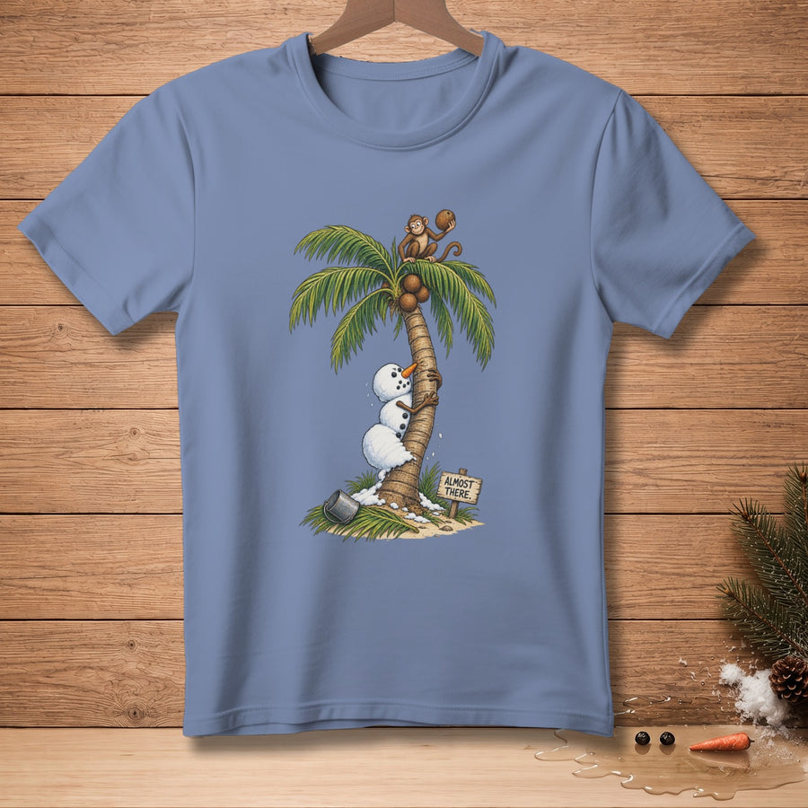 Snowman climbing palm tree with monkeys, a bucket, and "Almost There" sign.