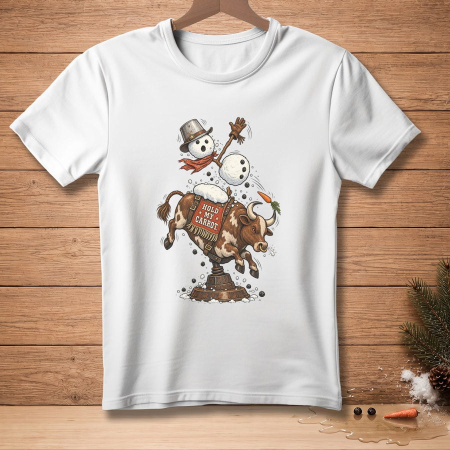 White t-shirt with a snowman riding a bucking bull, text says "Hold my carrot".