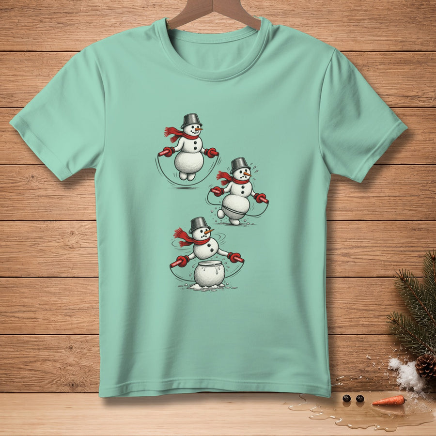 Mint t-shirt featuring three snowmen with red scarves jumping rope.