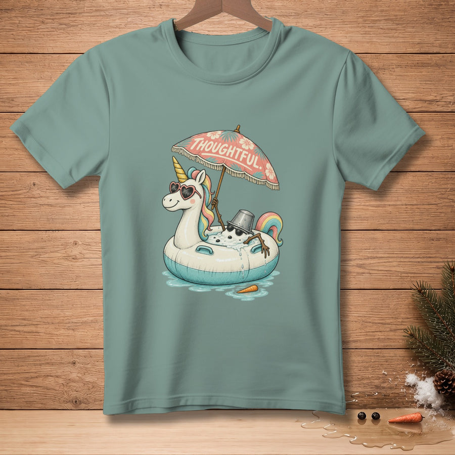 Unicorn with sunglasses relaxes on inflatable tube under umbrella that says "THOUGHTFUL."