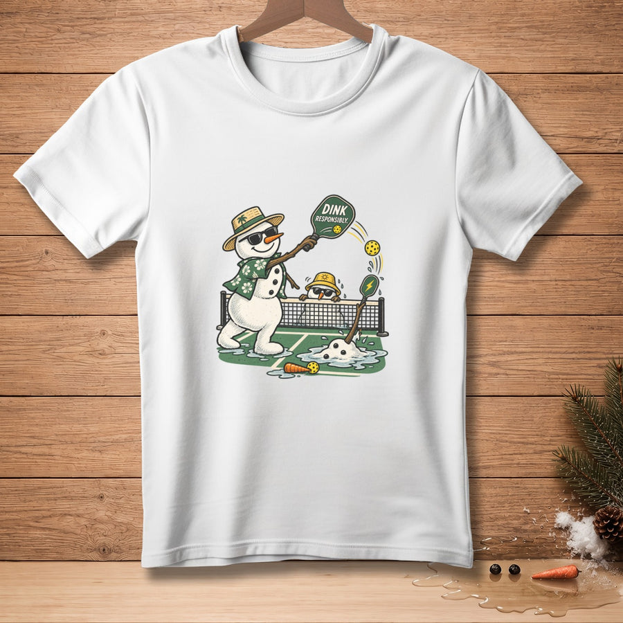 Snowmen playing pickleball on a court, one holds a paddle with text "DINK RESPONSIBLY".