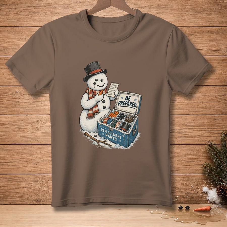 Snowman with top hat and scarf holding carrot, box of "Replacement Parts."