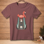 T-shirt with a flamingo float holding a melting snowman on an escalator.