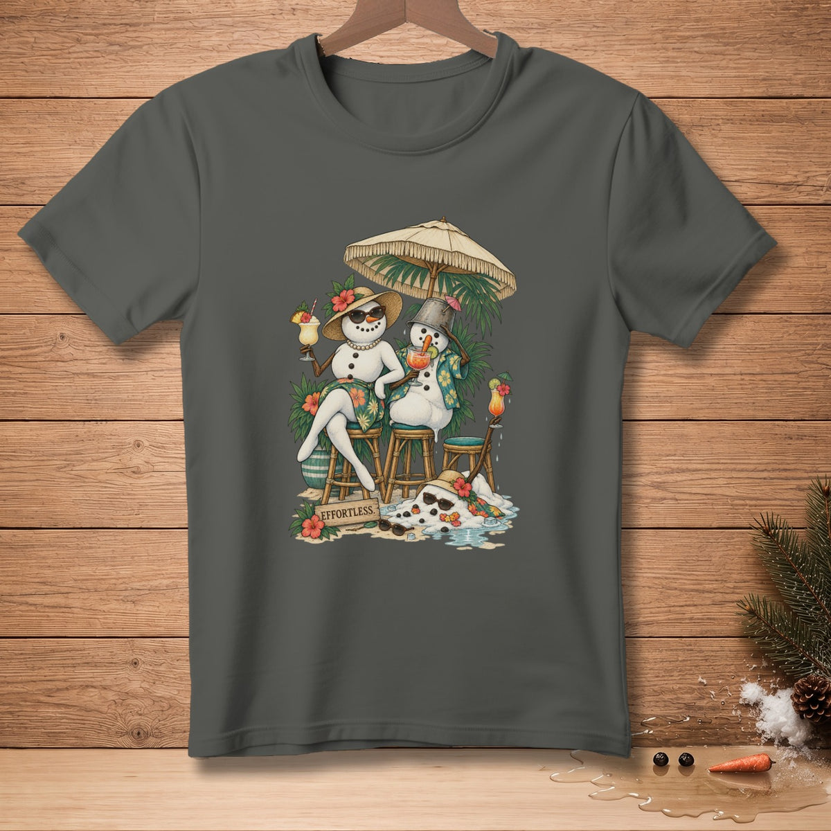 Two snowmen relax under an umbrella with tropical drinks and the word "EFFORTLESS."