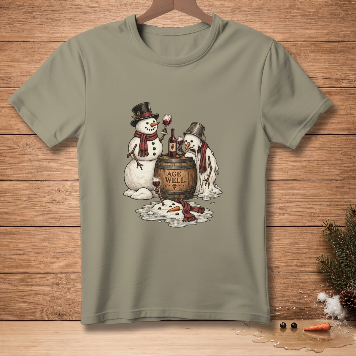 T-shirt graphic of two snowmen with wine and a barrel reading "AGE WELL."