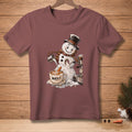 Snowman making coffee with text "WORTH IT." on a t-shirt.