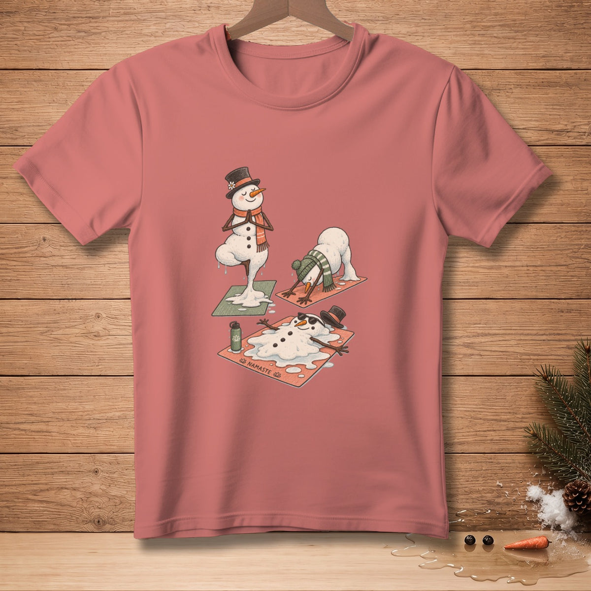 T-shirt graphic with melting snowmen doing yoga, one in a tree pose.