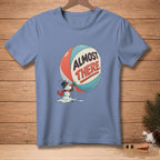 Shirt with a melting snowman pushing a large beach ball with "ALMOST THERE" text.