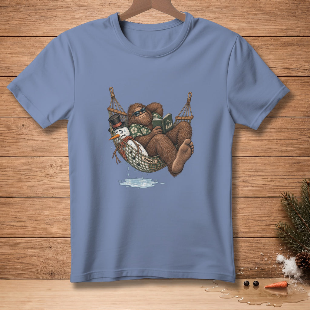 Bigfoot reading in a hammock next to a melting snowman wearing a top hat.