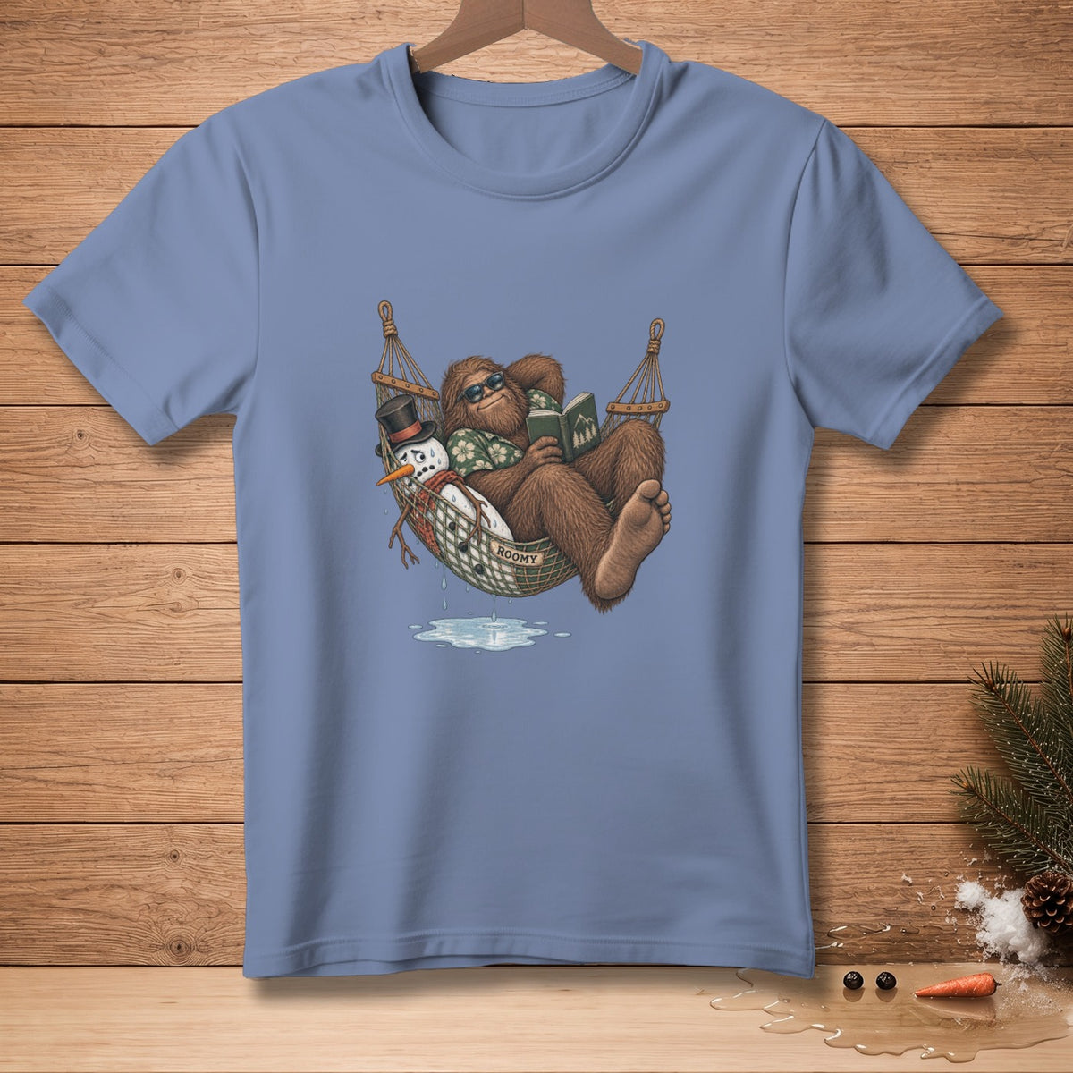 Bigfoot reading in a hammock next to a melting snowman wearing a top hat.
