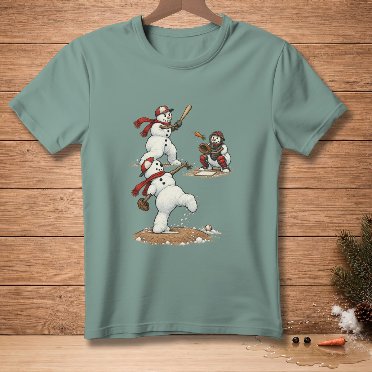 Snowmen playing baseball on a t-shirt with a pitcher, batter, and catcher.