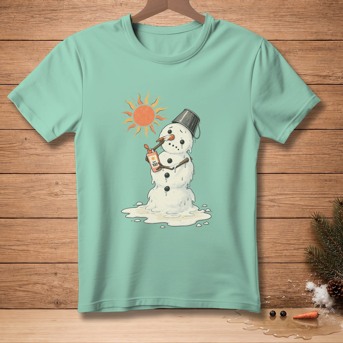 Mint green t-shirt with melting snowman applying SPF 100 sunscreen under a hot sun.
