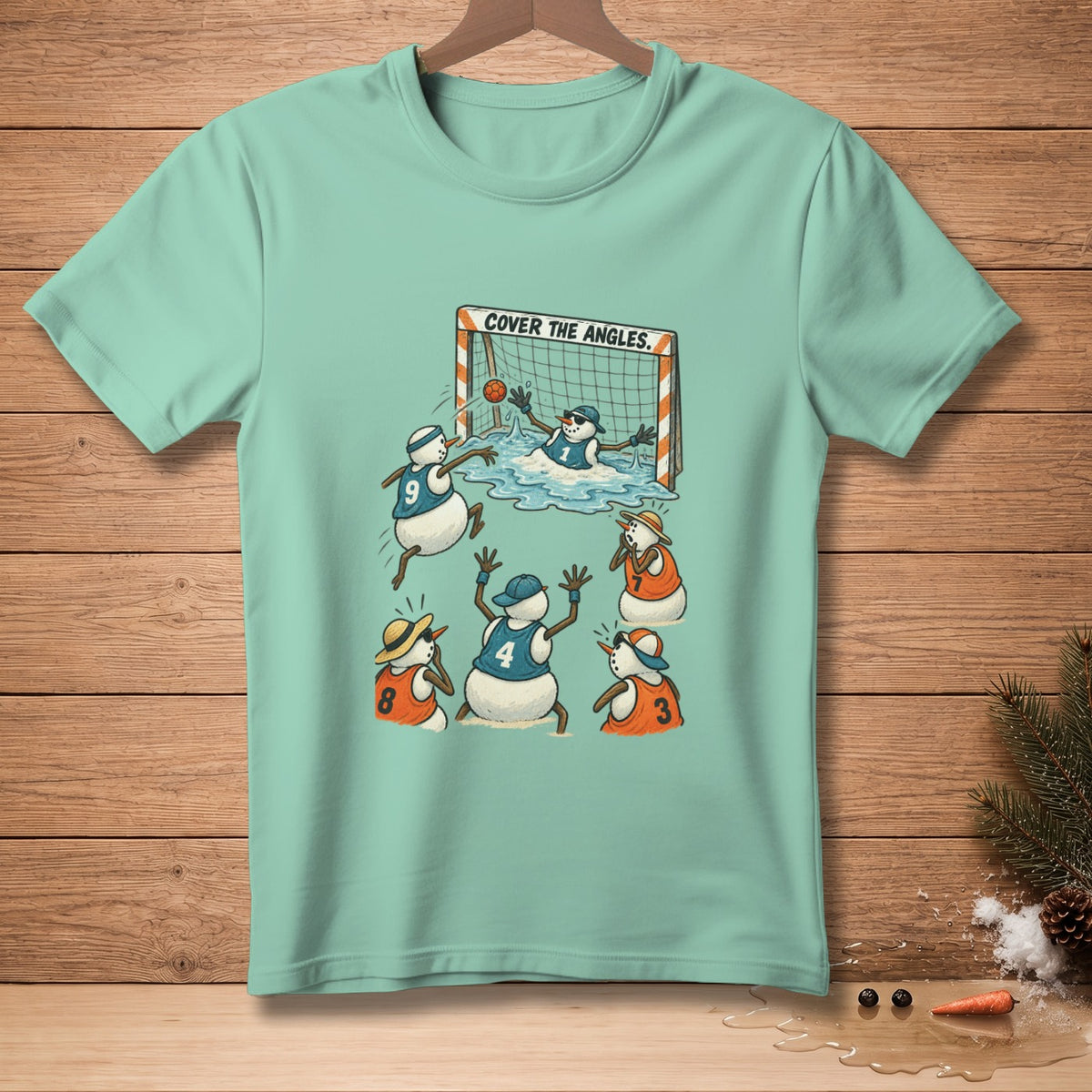 Snowmen playing soccer in jerseys with "COVER THE ANGLES." text above goal.