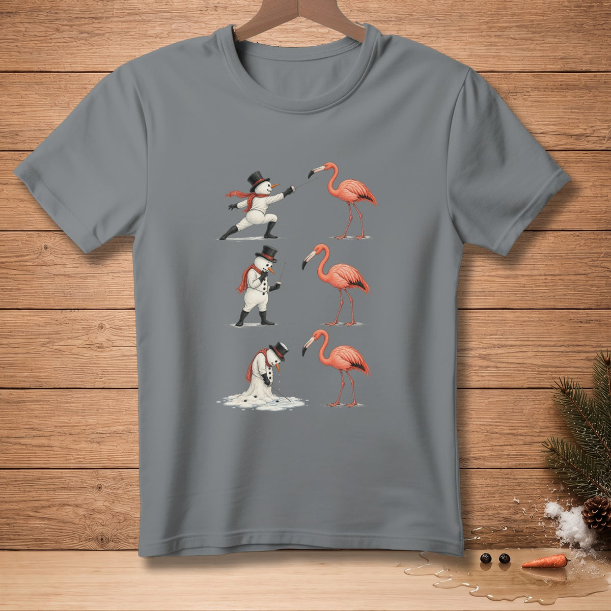 T-shirt graphic of snowmen interacting with flamingos in three different poses.