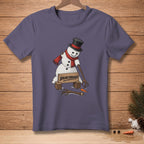 Snowman with top hat and scarf breaking through a "Breakthrough" sign.