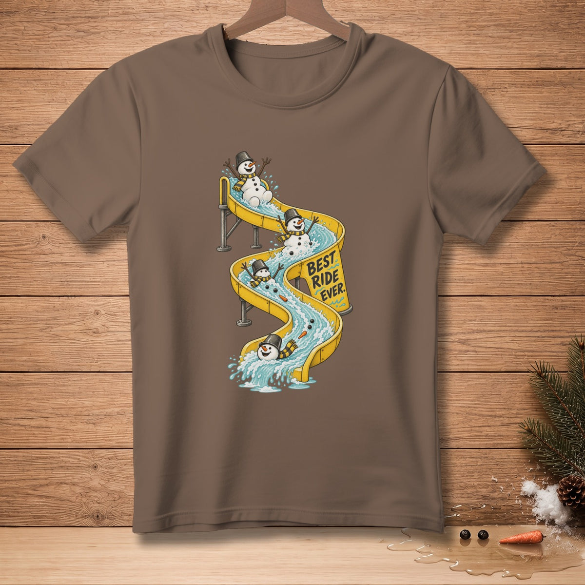 Brown t-shirt with snowmen on a water slide, text "Best Ride Ever."