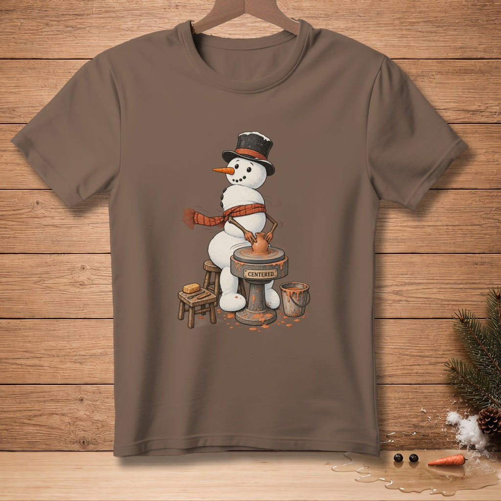 Snowman wearing a top hat and scarf at a pottery wheel, text "CENTERED."