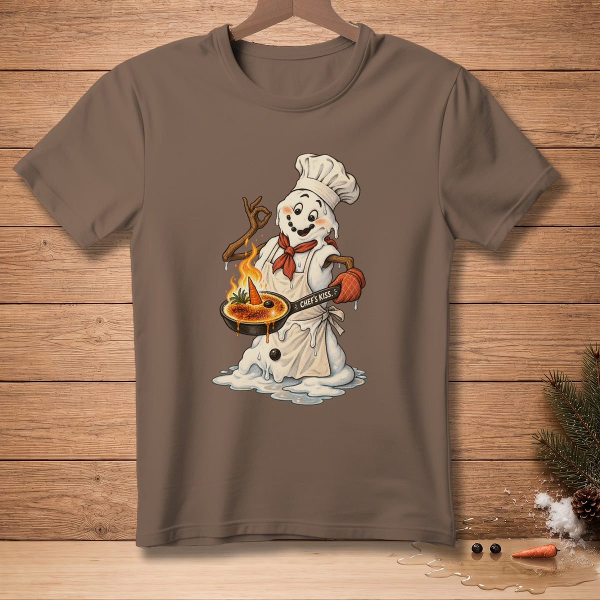 Snowman chef melting, holding a pan with burnt caramel and a carrot.