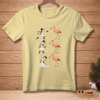 Light yellow t-shirt with cartoon snowmen interacting with flamingos.