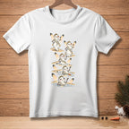 White t-shirt with cartoon snowmen wearing sashes and crowns in a melting sequence.