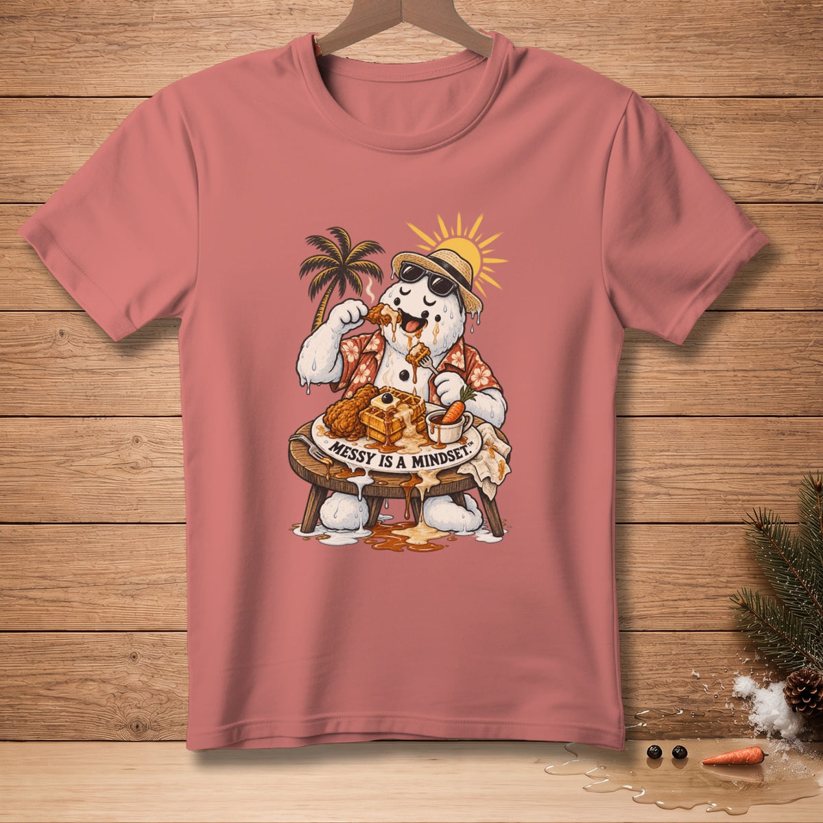 Snowman eating waffles and chicken on a tropical beach, text reads "Messy is a mindset".