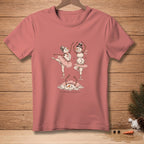 Snowmen ballerinas in tutus and hats dance on a pink t-shirt with "Swan Lake" text.