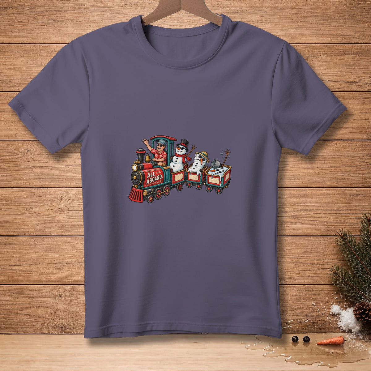 T-shirt graphic of a train with snowmen, reading "ALL ABOARD."