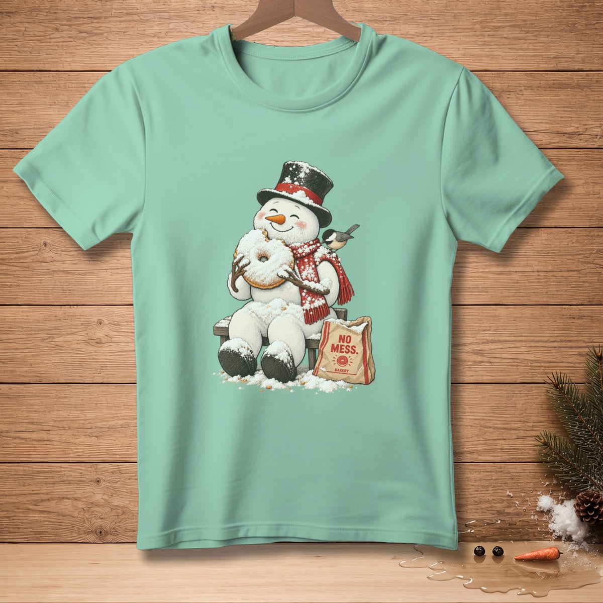 Snowman in top hat and scarf eating a donut, with "No Mess Bakery" bag.