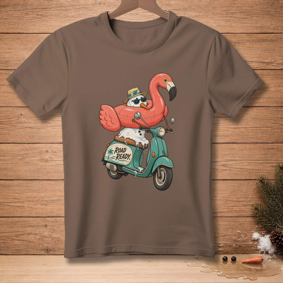 Snowman with flamingo float and sunglasses rides scooter, text reads "Road Ready."