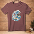 T-shirt with a cartoon snowman and turtle surfing on a wave.