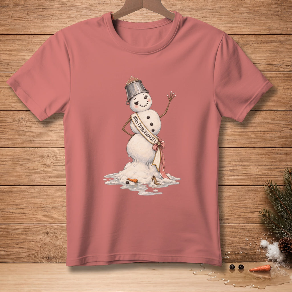 Melting snowman with tiara and "Miss Congeniality" sash on a pink t-shirt.