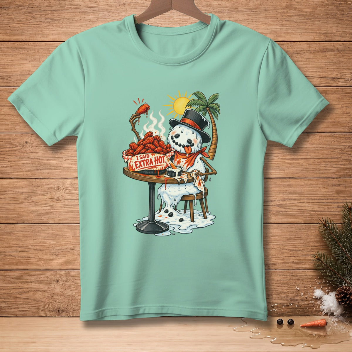 Snowman eating spicy chicken wings with "I SAID EXTRA HOT" text.