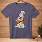 Snowman chef wearing a chef's hat, apron, and red scarf holding a brûlée pan.
