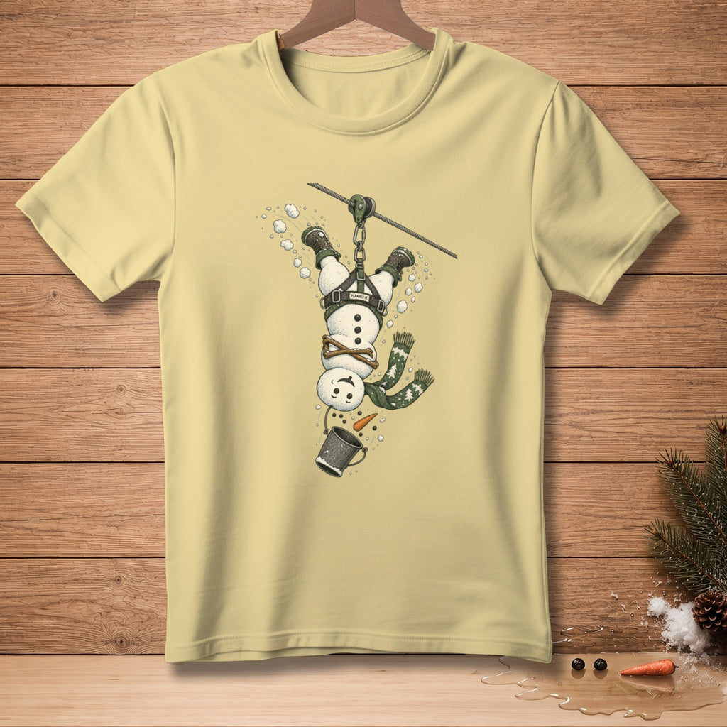 Light yellow t-shirt with a snowman zip-lining upside down.