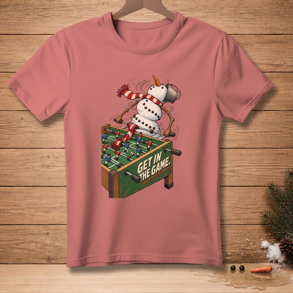 Snowman playing foosball with text "GET IN THE GAME" on t-shirt.