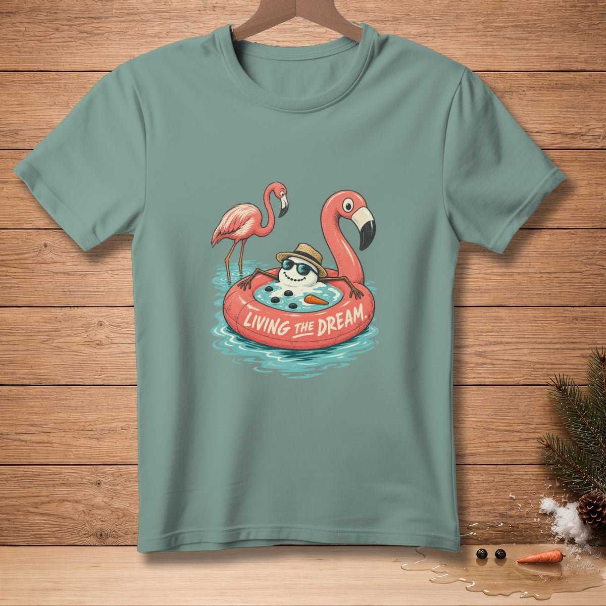 Snowman in flamingo float with two flamingos, text "LIVING THE DREAM."