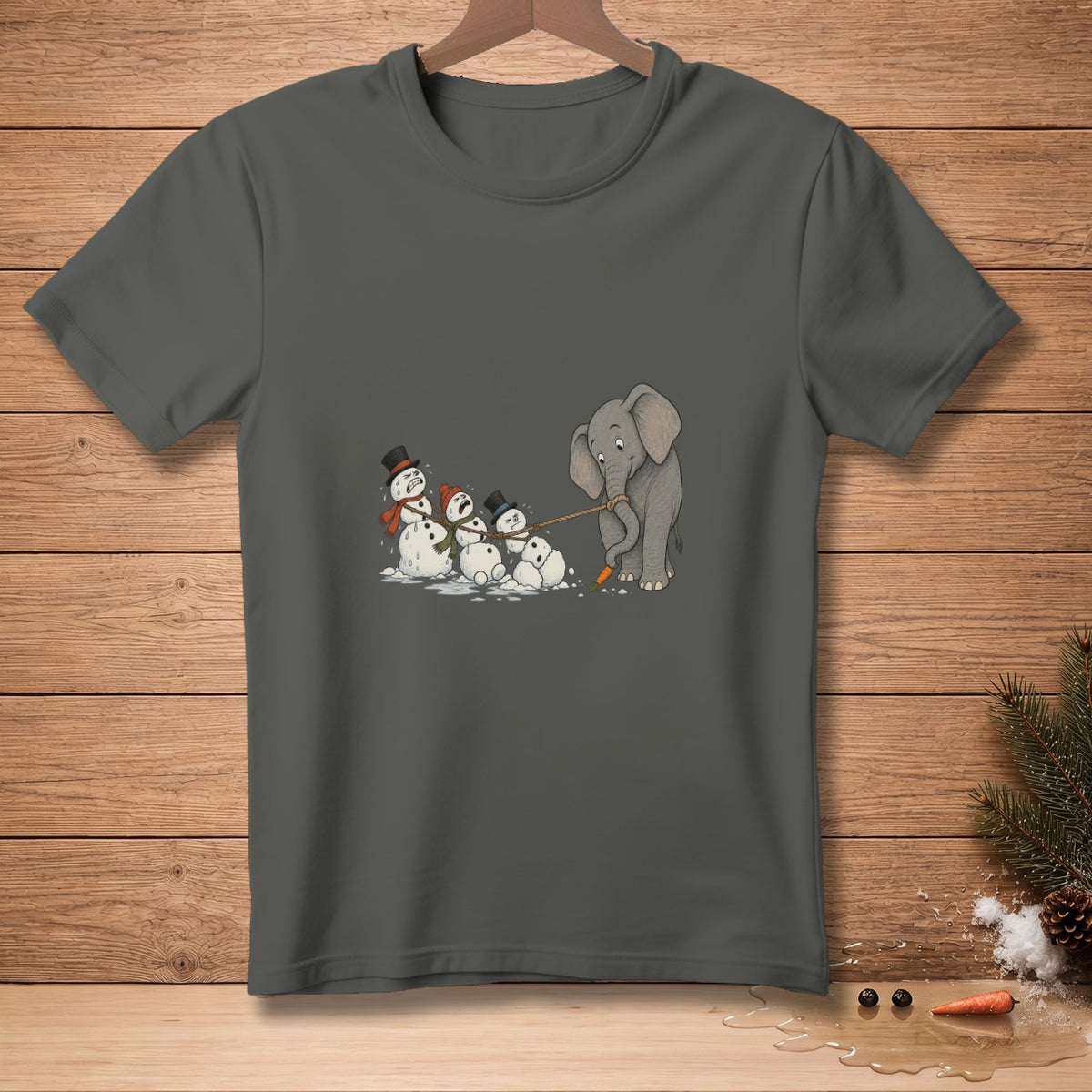 Elephant pulling snowmen with a carrot and rope on a charcoal t-shirt.