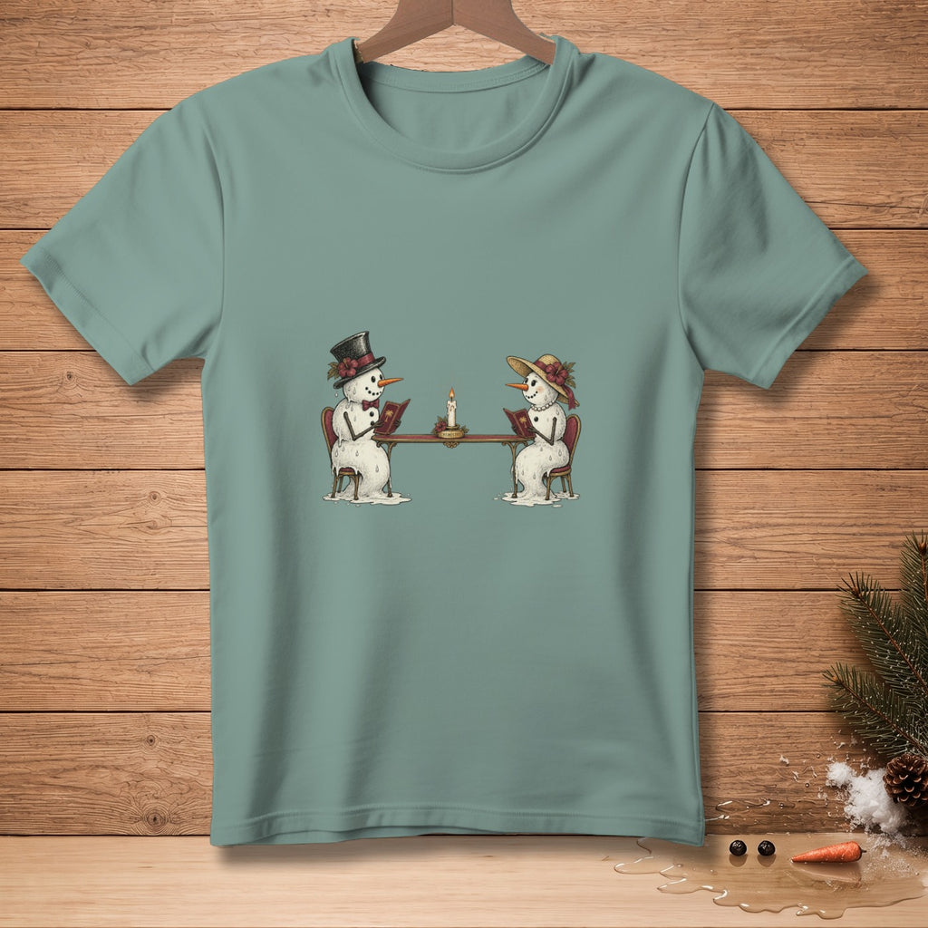 Two snowmen, one in a top hat, read books at a table by candlelight.