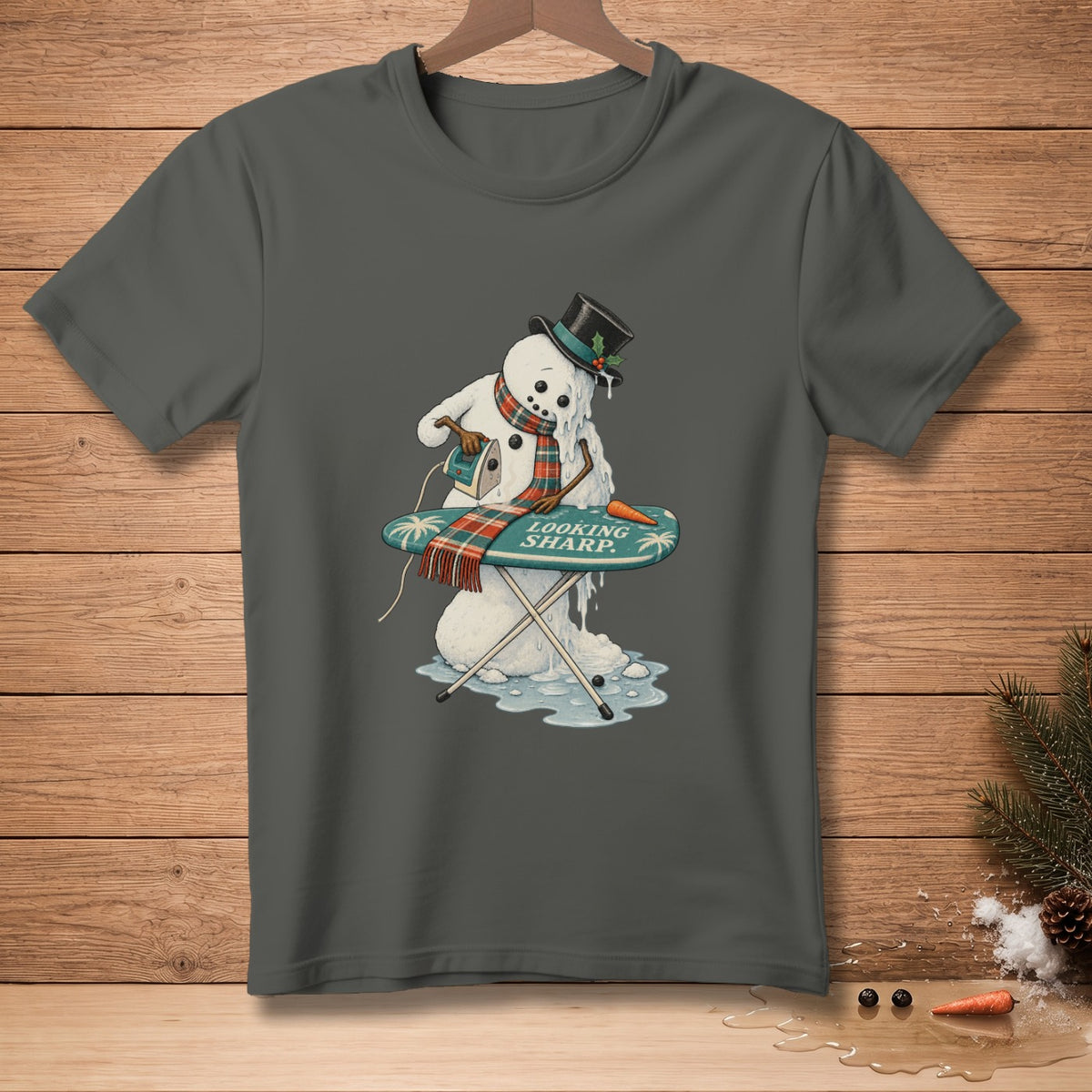 Melting snowman ironing, with "Looking Sharp" text on ironing board.