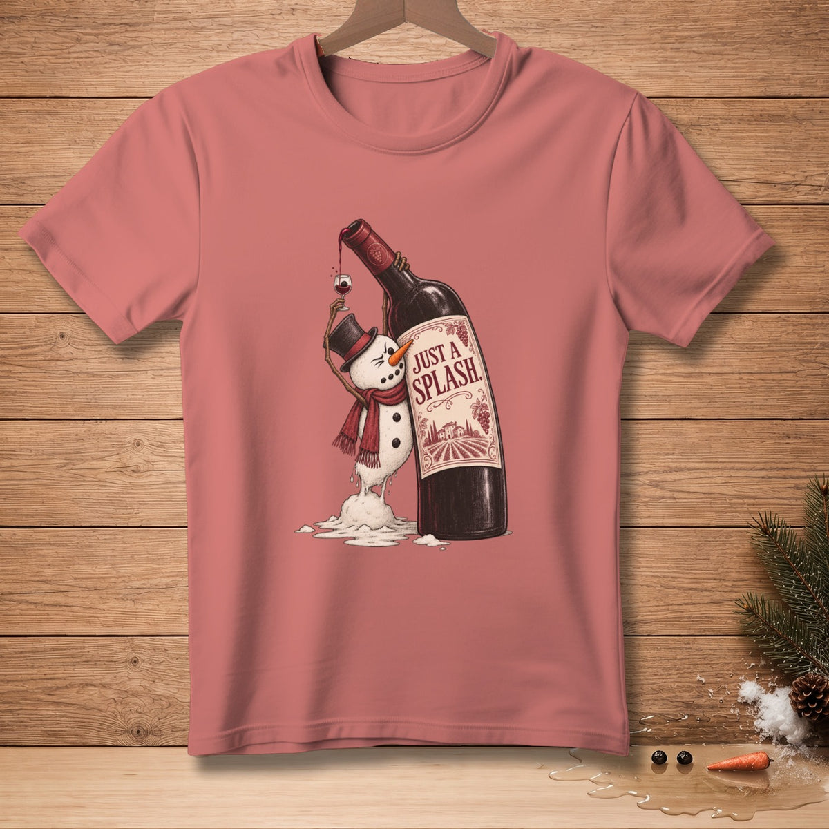 T-shirt graphic of melting snowman holding a wine glass next to a wine bottle reading "Just a Splash."