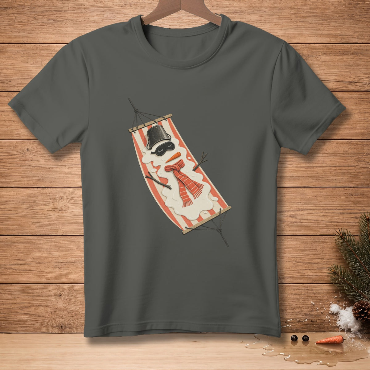 Snowman wearing a hat and scarf relaxing in a hammock on a dark grey t-shirt.