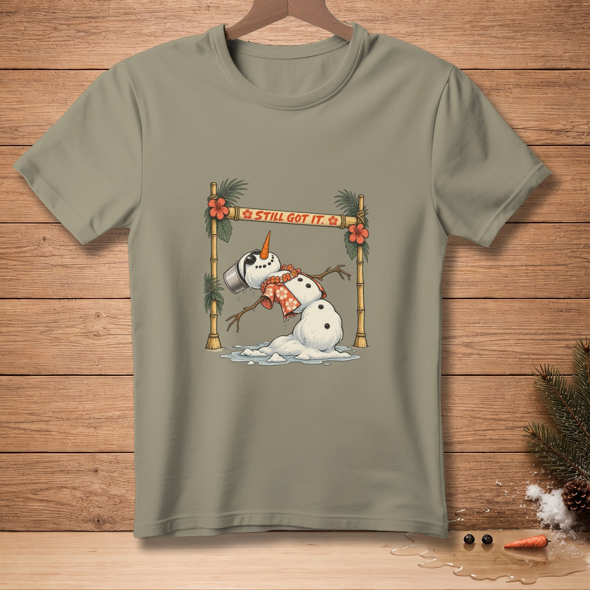 Melting snowman wearing Hawaiian shirt and lei with text "STILL GOT IT."