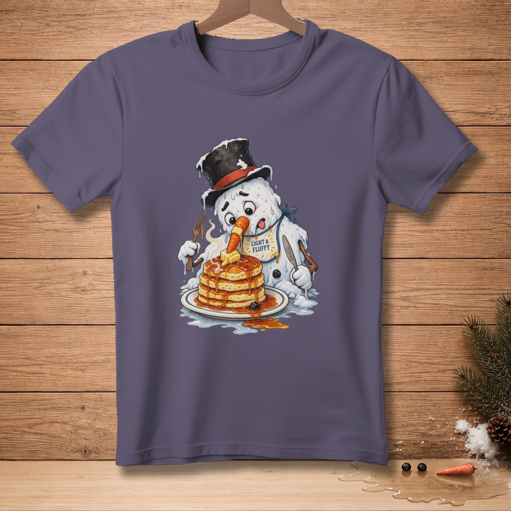 Snowman eating pancakes with fork and knife, text "Light & Fluffy" on bib.
