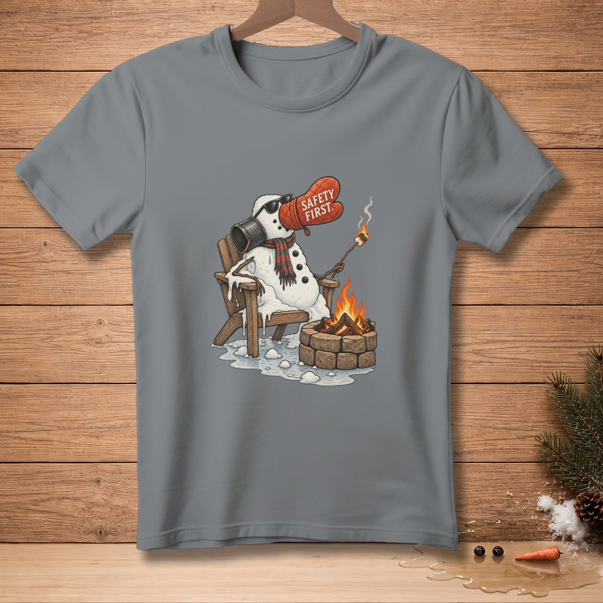 Snowman in a chair by a campfire, holding a marshmallow with a pot holder that says "Safety First."