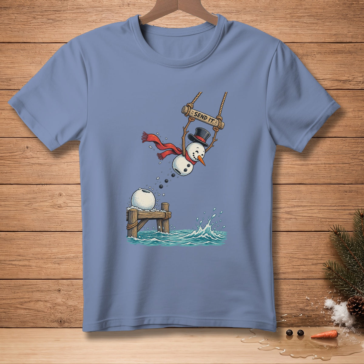 Snowman on swing with "SEND IT." text, jumping into the water.