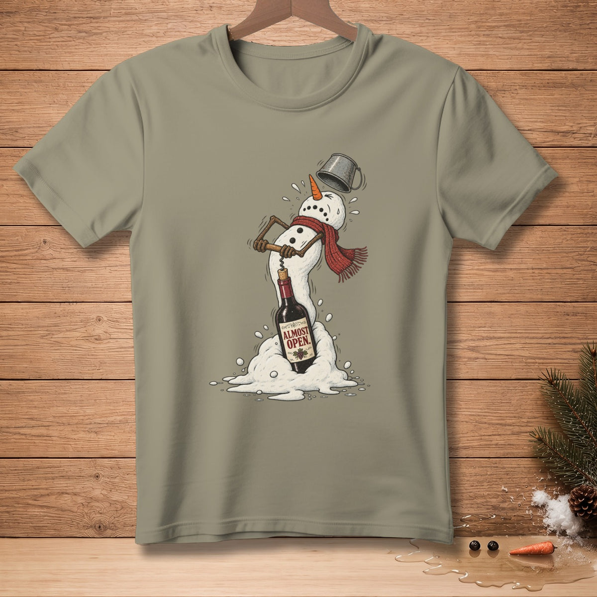 Snowman struggling to open wine bottle with text "ALMOST OPEN" on t-shirt.