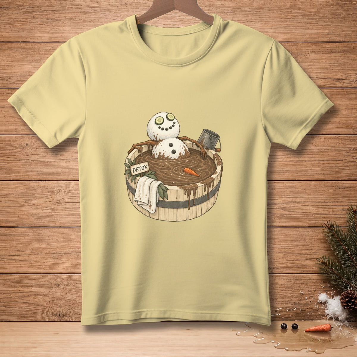 Snowman in a tub of mud with cucumber eyes and a sign that says "DETOX".