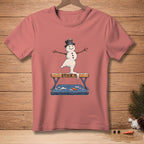Snowman in a top hat and twig arms balancing on a vaulting horse with "STICK IT" text.