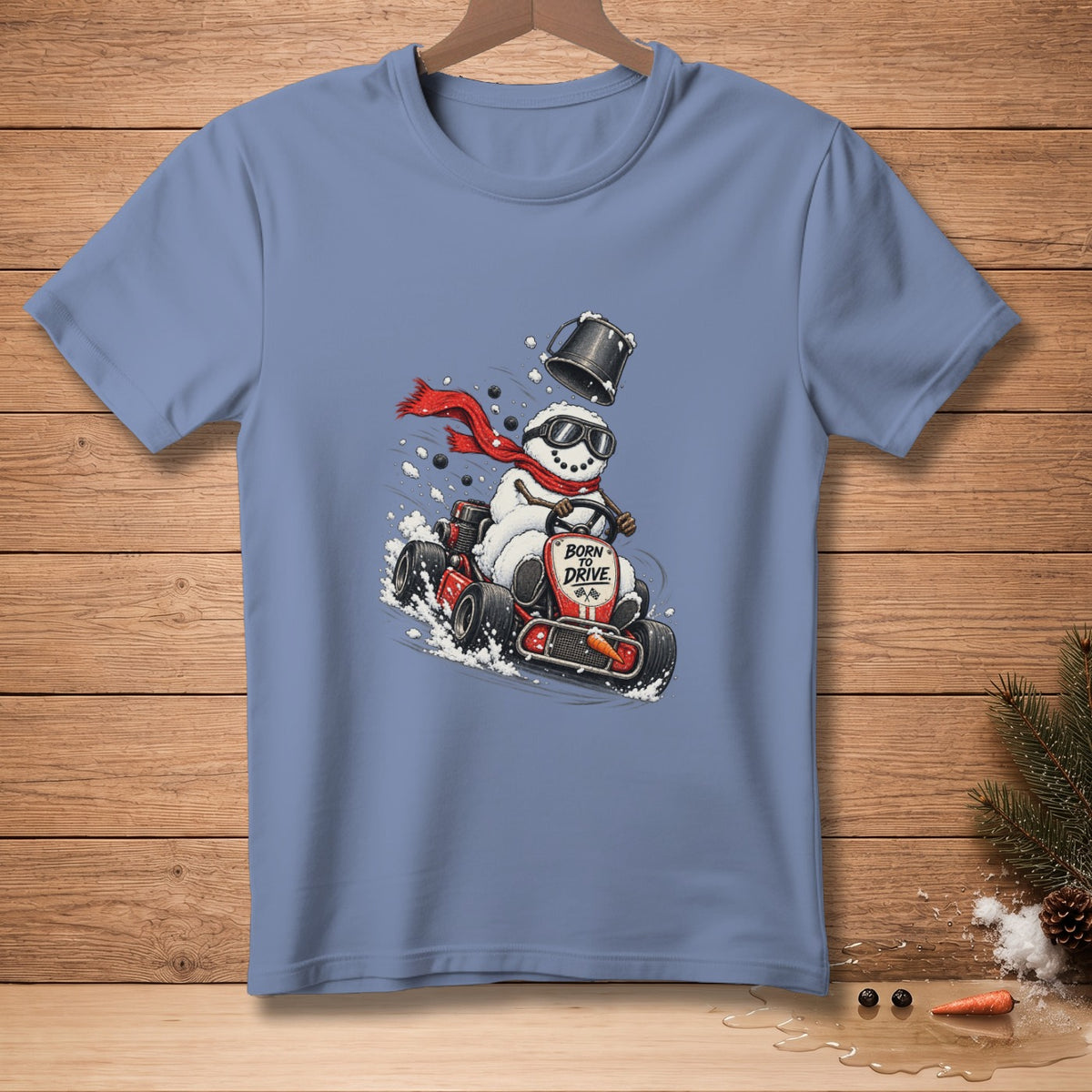 Snowman in go-kart wearing scarf and sunglasses, text "Born to Drive".